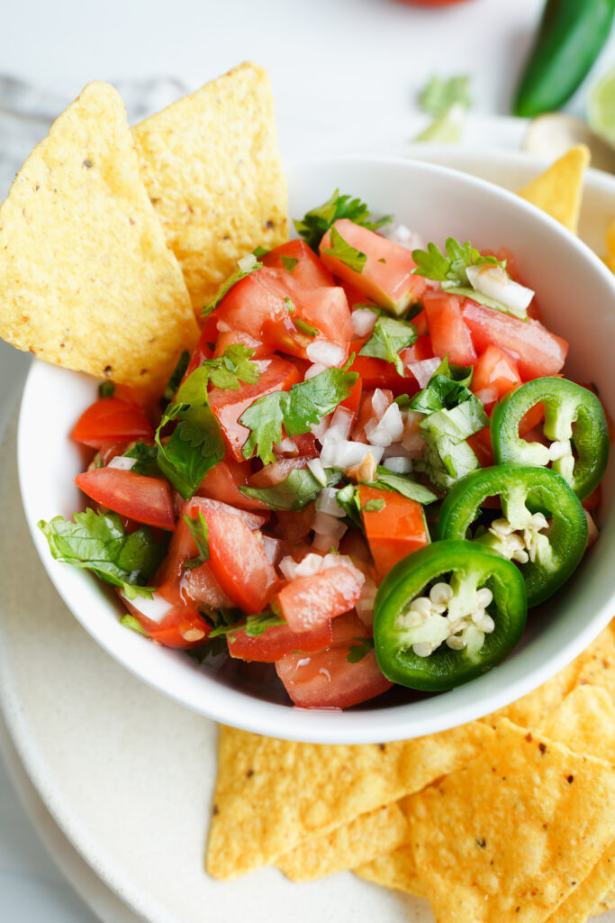 close up of homemade pico de gallo served with chips