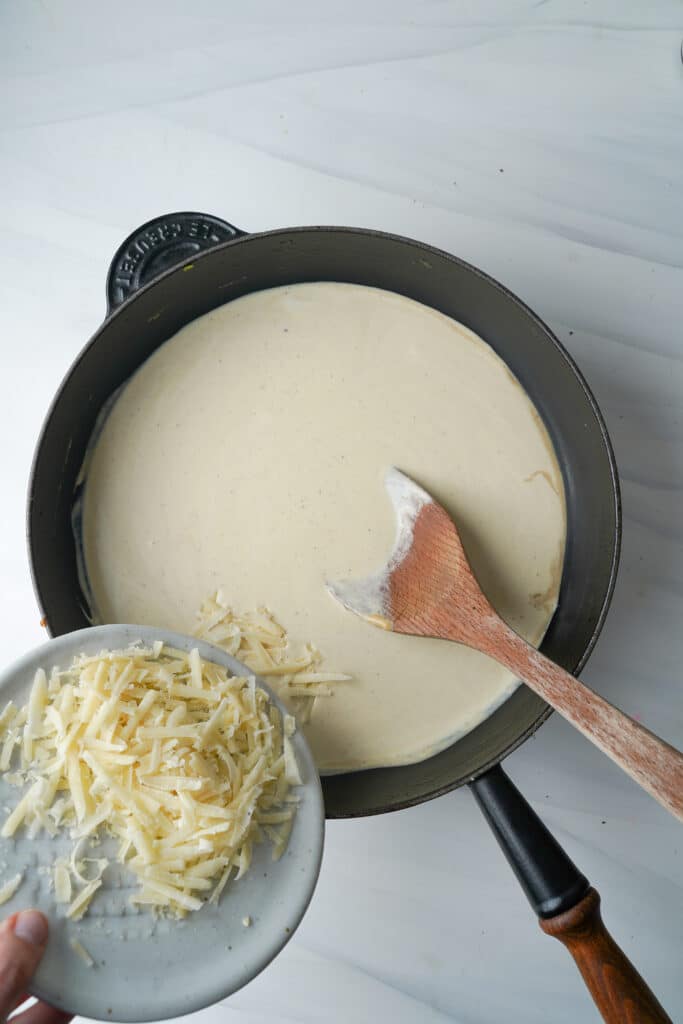 Mixing cream and cheese for Fettuccine Alfredo | cookingwithcassandra.com