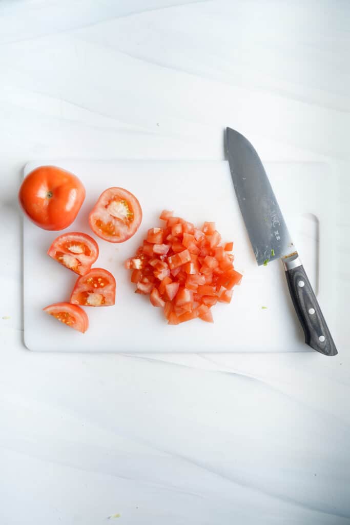 Cutting tomatoes for nachos recipe  | cookingwithcassandra.com