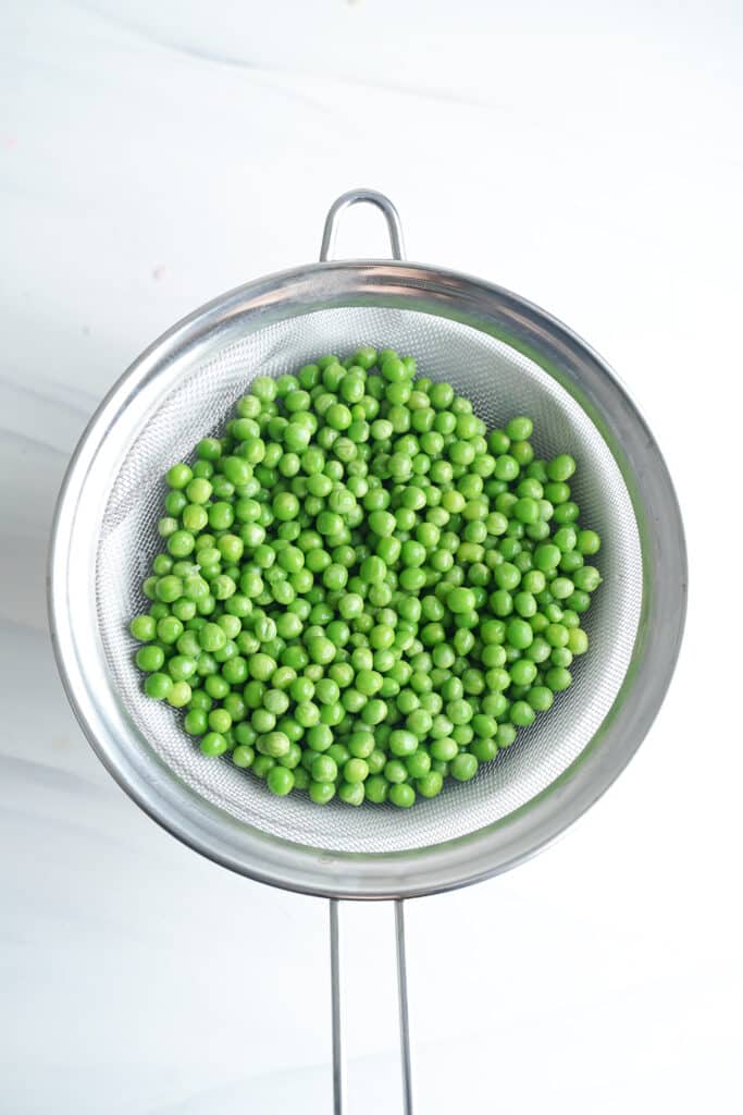 Peas in Food Strainer | cookingwithcassandra.com