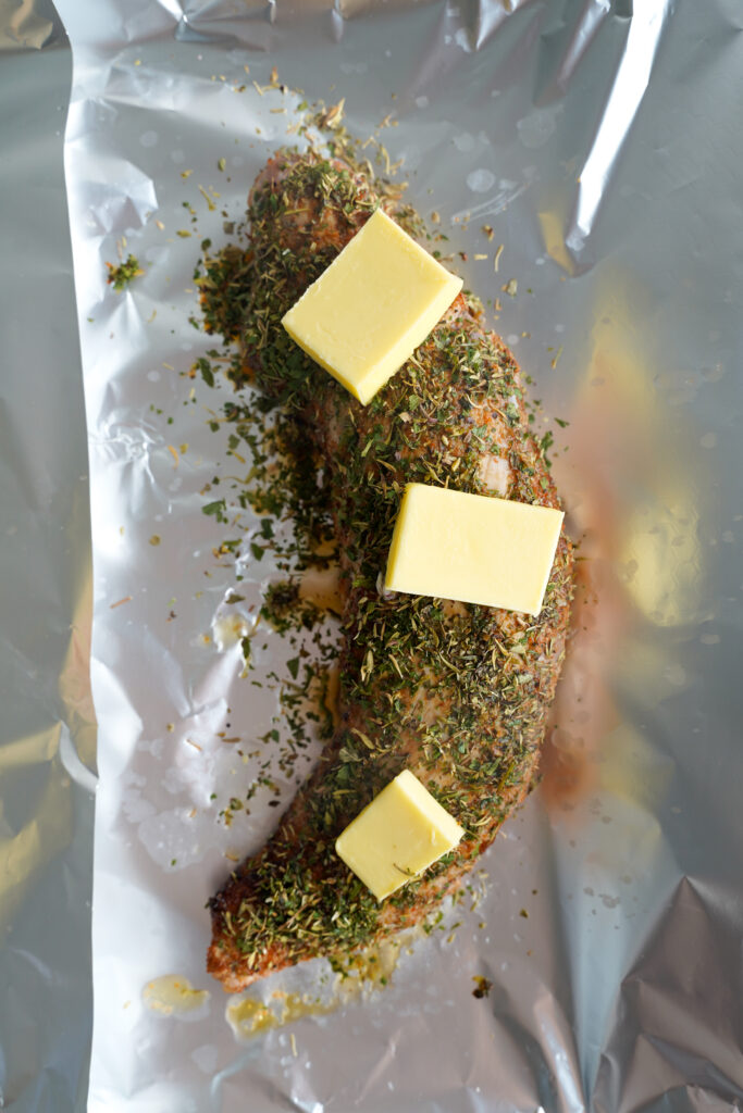 pork tenderloin topped with three pads of butter | cookingwithcassandra.com