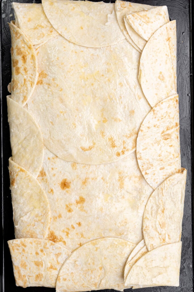 Sheet pan chicken quesadillas fully assembled and ready to be baked in the oven
