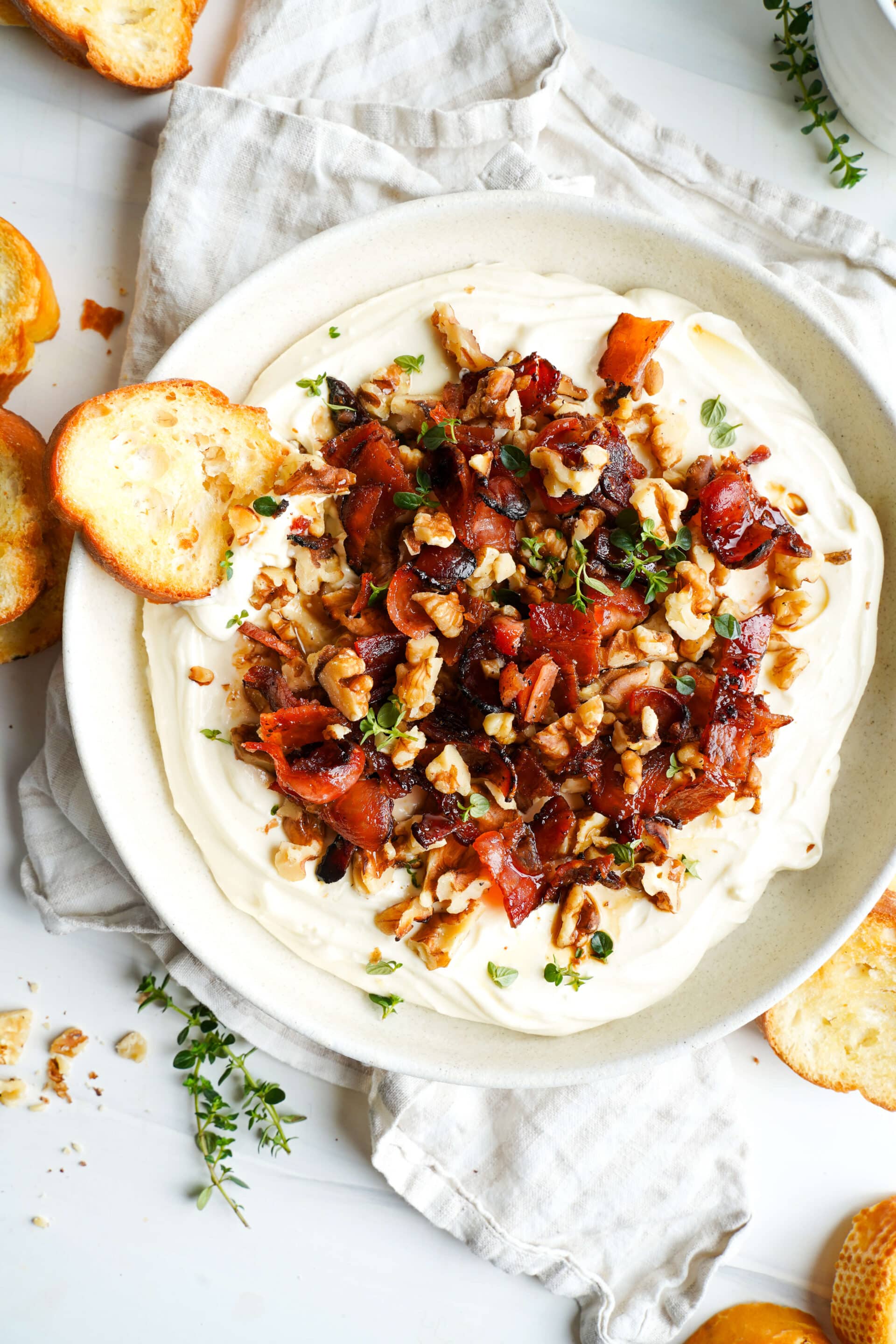 Whipped feta topped with maple bacon and toasted walnuts served with crostini
